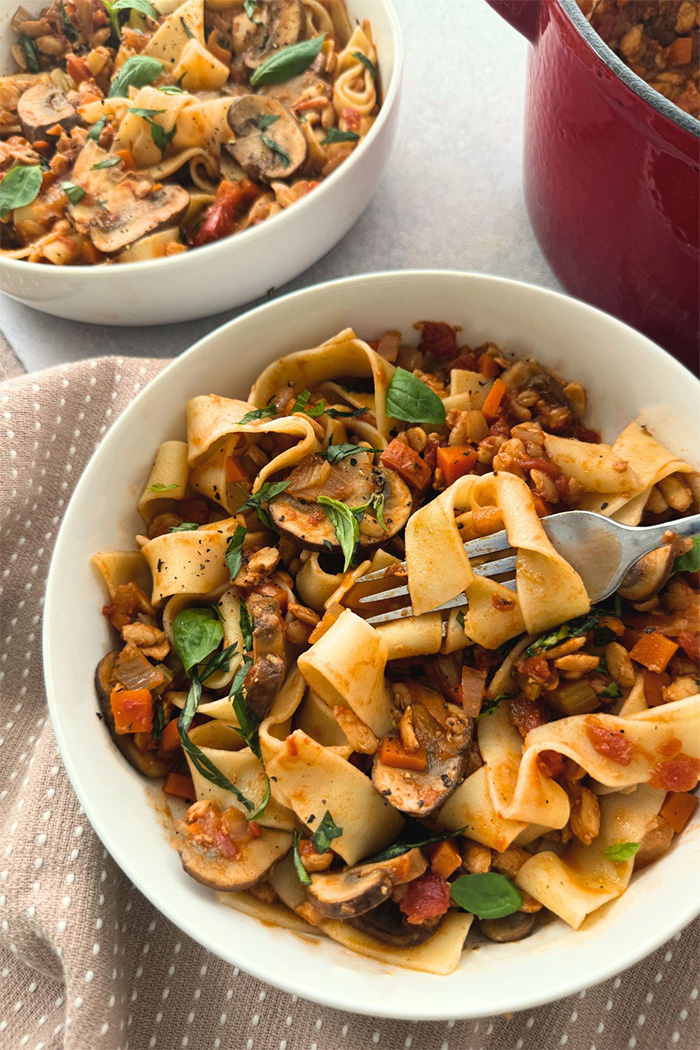 Dairy free and vegan pappardelle with a tempeh mushroom bolognese sauce