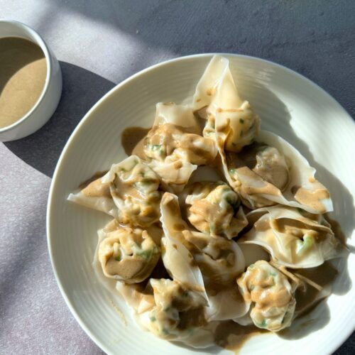 tofu and chives vegan dumplings with sweet savory sesame sauce