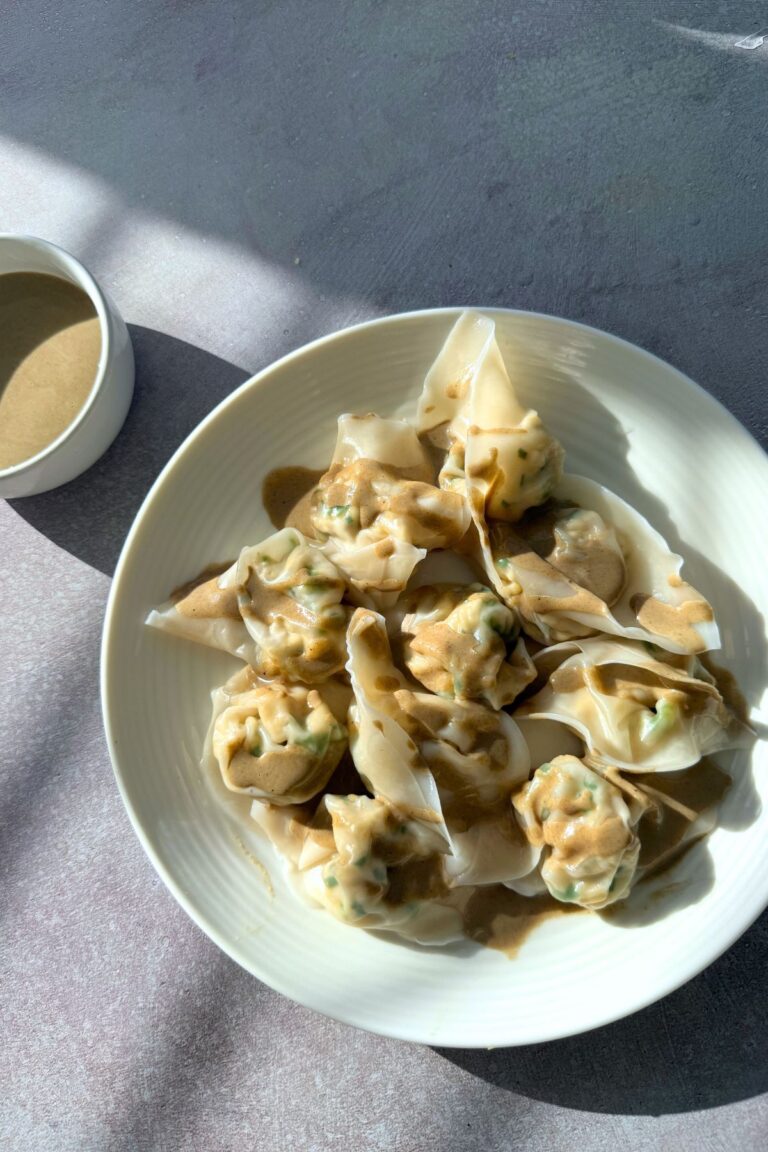 tofu and chives vegan dumplings with sweet savory sesame sauce