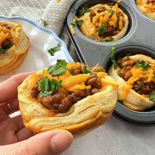 Vegan lentil sloppy joe with cheddar cheese stuffed in flaky biscuits