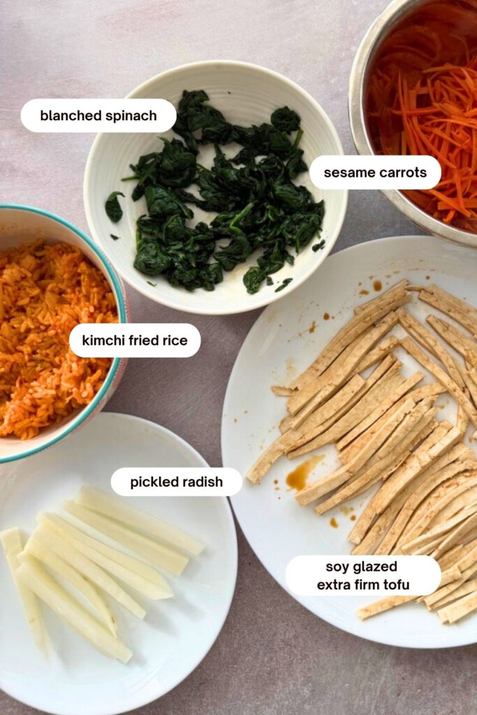 ingredients and fillings for a vegan kimchi fried rice kimbap 