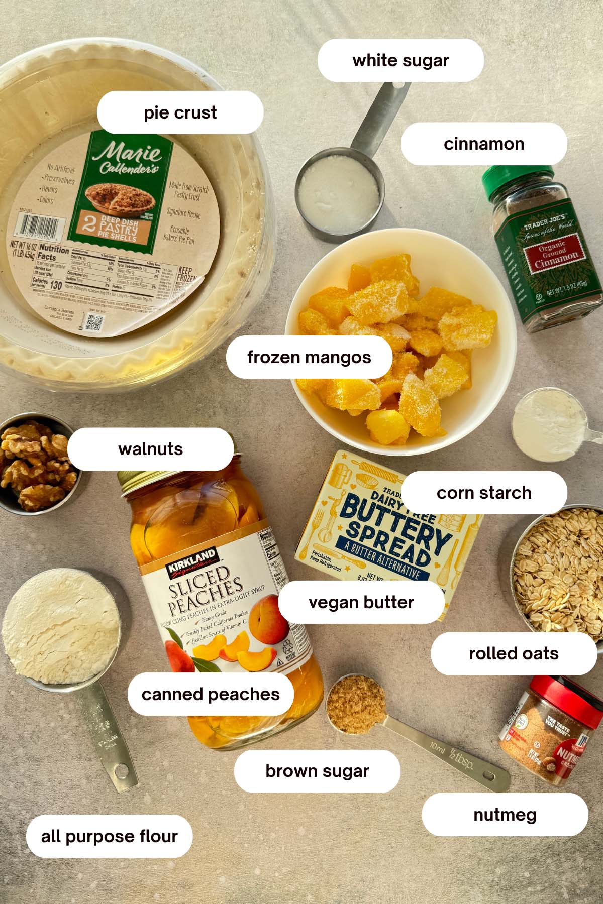 mango and canned peach pie with crumble topping recipe ingredients list, rolled oats, walnuts, pre-made crust, sugar, cinnamon, nutmeg