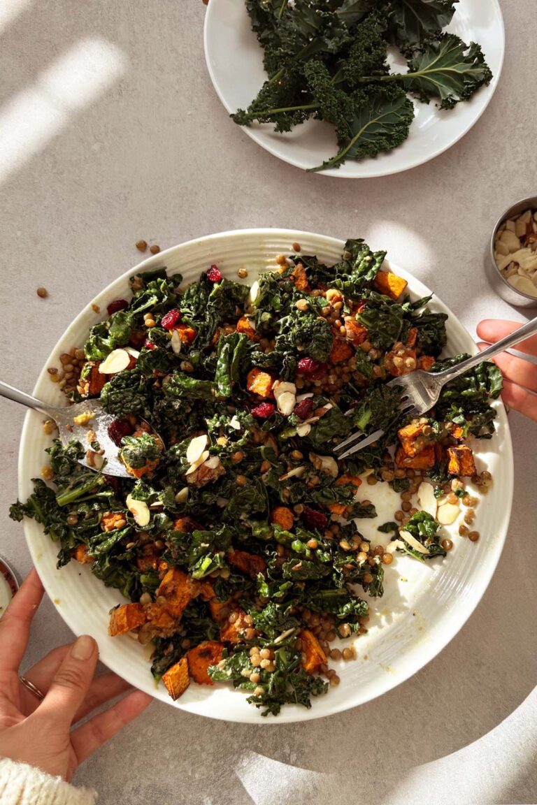 Warm kale and lentil salad with maple dijon poppy seed vinaigrette, sweet potato, and almond slices
