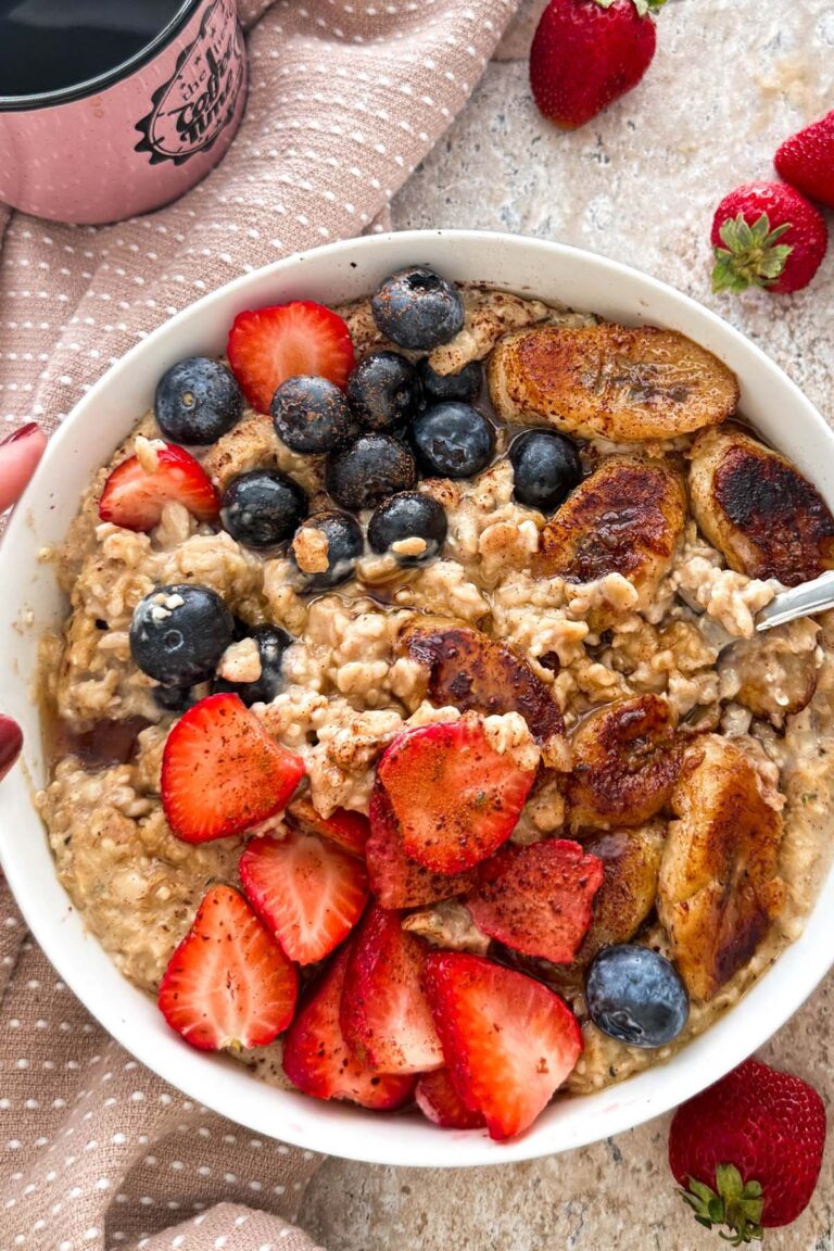 high protein vegan oatmeal breakfast power bowl with hemp seeds strawberries, blueberries, banana