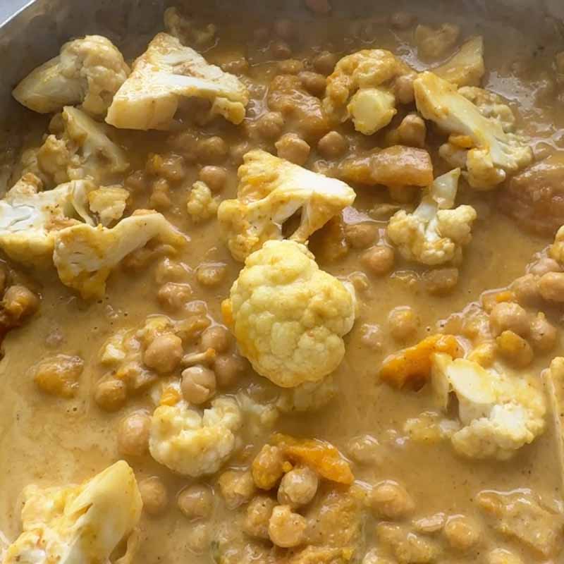 simmer cauliflower and chickpeas in thai yellow curry