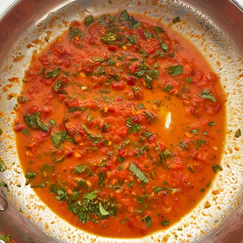 roasted cauliflower bites tossed in harissa sauce