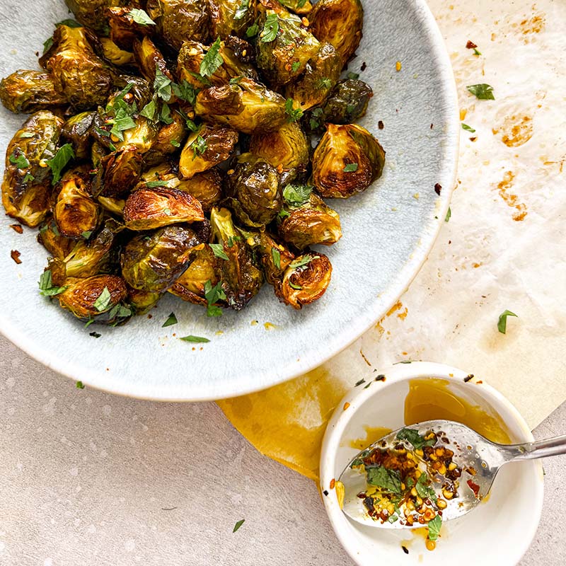 crispy roasted brussels sprouts mixed with homemade hot honey
